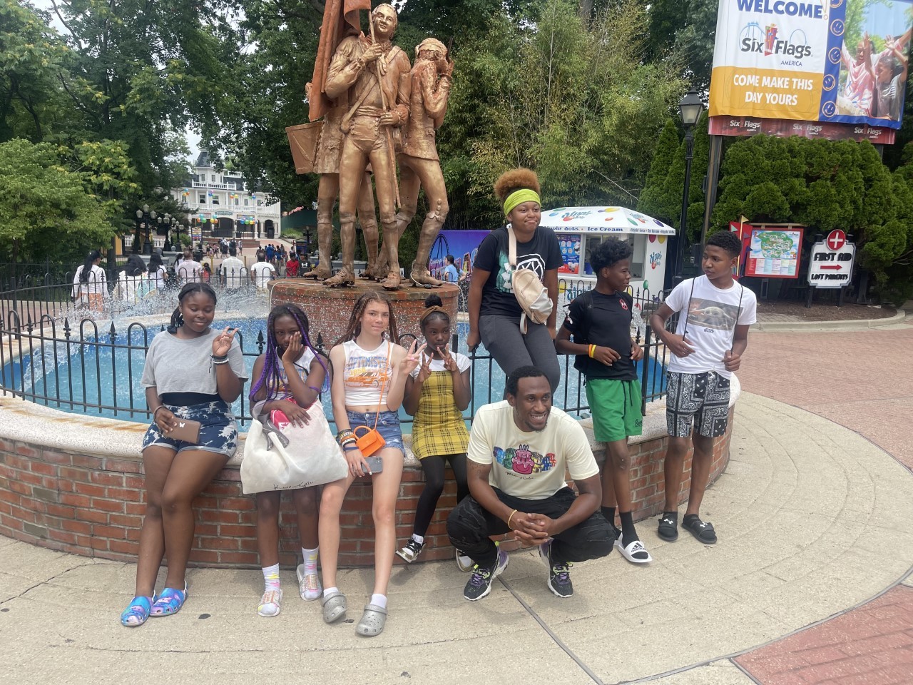 Teenagers Sitting Near The Monument